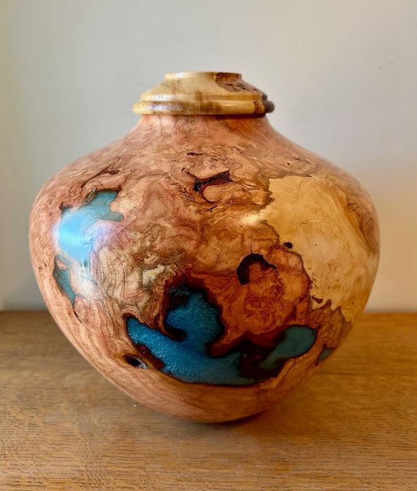 Burled cherry turned urn with sky blue epoxy