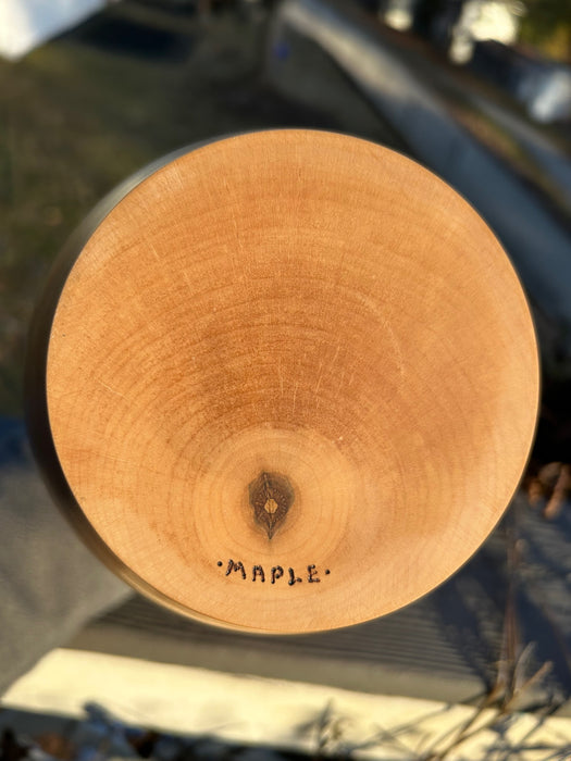 Bottom of hand turned maple urn