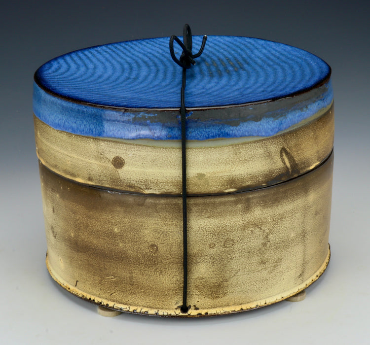Black Clay Cylindrical Ceramic Urn with Cobalt Blue Lid - Angle 4