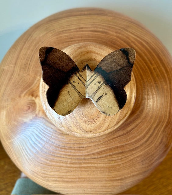Comes with a beautifully made wooden carved butterfly on top of the lid