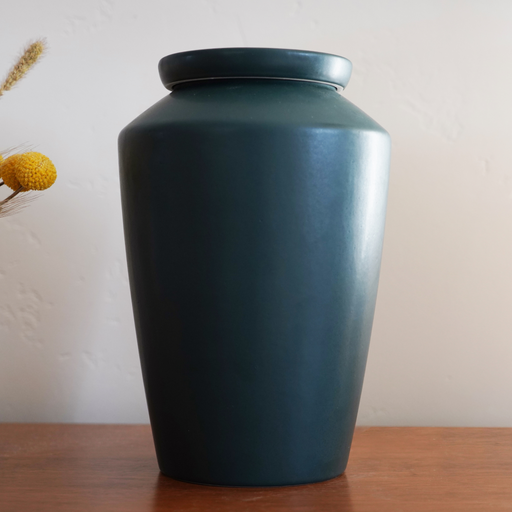 Modern Ceramic Cremation Urn in Green in live setting