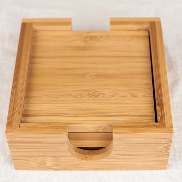 Includes matching bamboo wood coaster holder