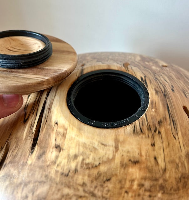 Comes with top opening threaded lid